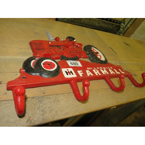 680 - McCormick cast iron coat hanger