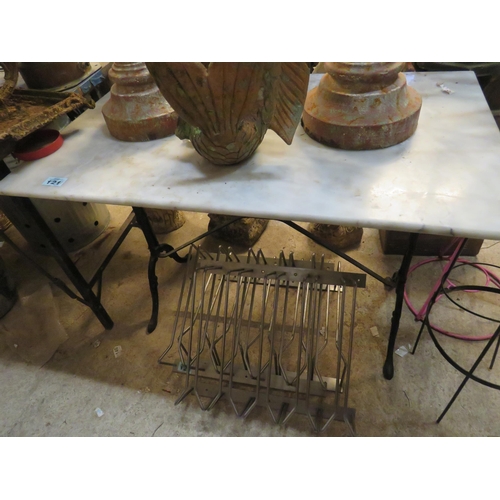 121 - Marble top table on iron stand 23