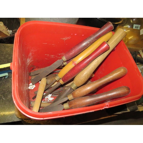 87 - Bucket of chisels