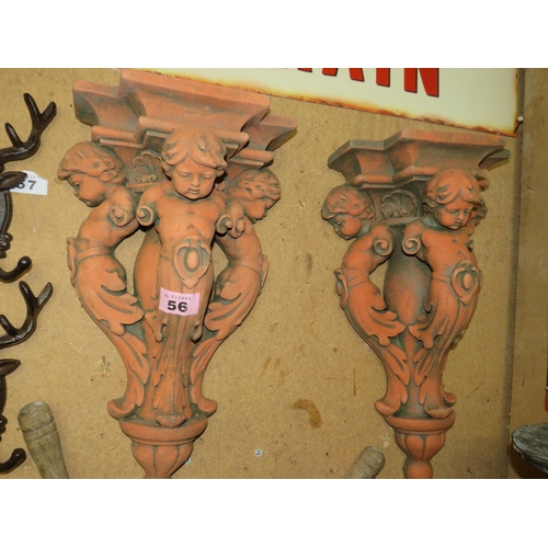 56 - Pair terracotta cherub wall stands 20