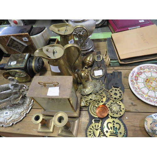 77 - 2 Victorian brass water jugs,horse brasses,mantle clock & 2 candlesticks