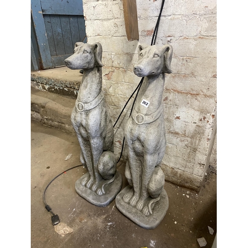 262 - Pair of reconstituted stone lurchers, 32