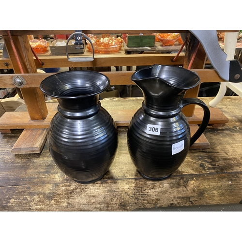 306 - Black jug and vase