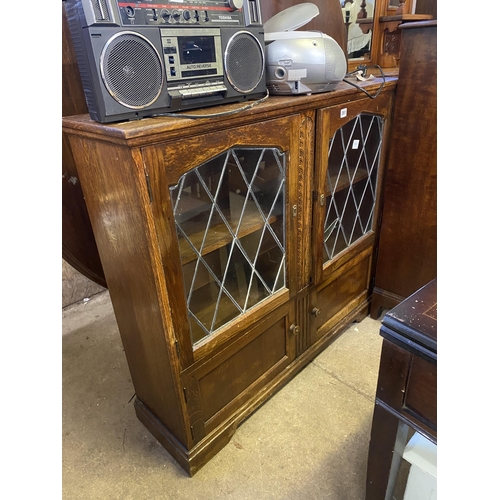 351 - Oak leaded light bookcase