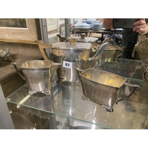 83 - Silver deco 3 piece tea service with lead scroll engraving on bracket feet, Sheffield 1939, 1276g to... 