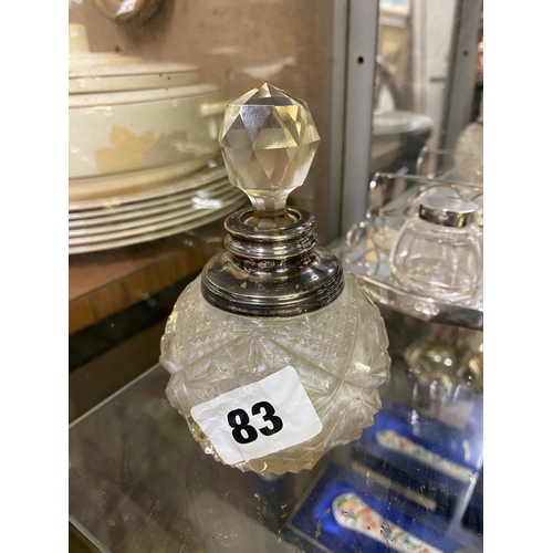 83 - Silver rimmed glass scent bottle