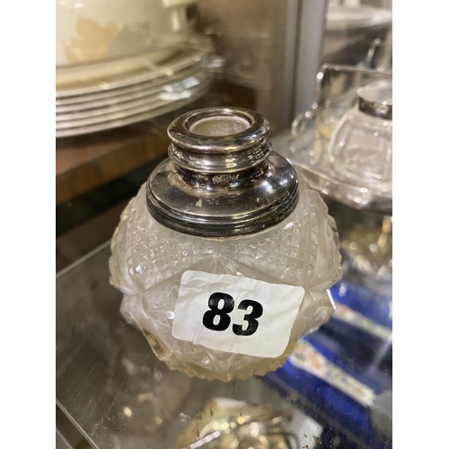 83 - Silver rimmed glass scent bottle