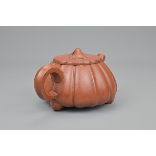 14 - A chinese yixing pottery tea pot. diameter approx. 16cm