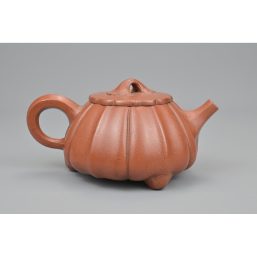 14 - A chinese yixing pottery tea pot. diameter approx. 16cm