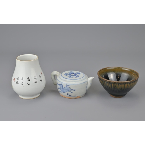 18 - Three chinese small items. together with black tea bowl, blue and white water dropper and vase. vase... 