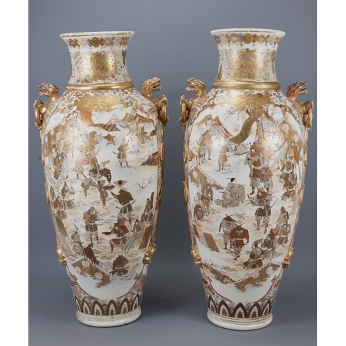 A large pair of japanese satsuma vases late meiji period with moulded dragon handles. decorated with samurai warriors. height approx. 79cm each (2)