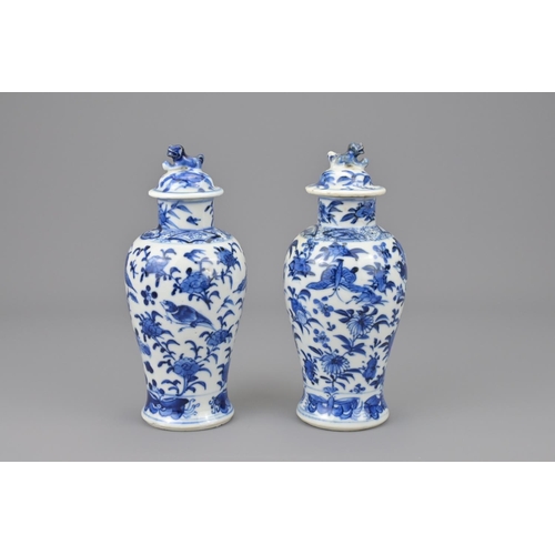 2 - Two chinese blue and white porcelain vases with covers. 19th century. total height approx. 17 cm (2)... 