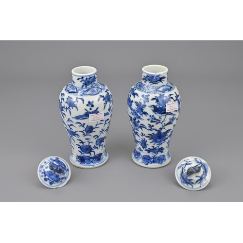 2 - Two chinese blue and white porcelain vases with covers. 19th century. total height approx. 17 cm (2)... 