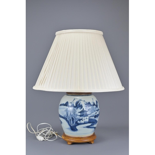 324 - An 18th century chinese blue and white porcelain vase converted into a lamp. together with pleated s... 