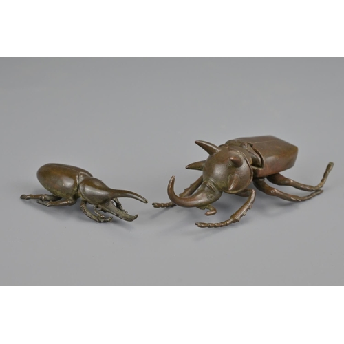 329 - Two japanese late meiji period bronze beetles. larger with opening box cover. each signed underneath... 