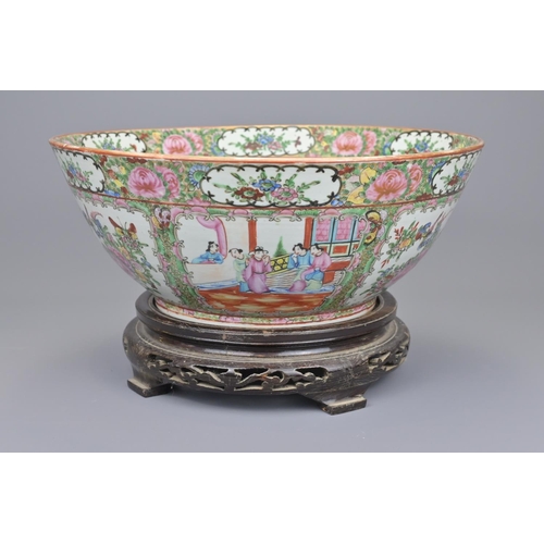 42 - A 19th century chinese cantonese punch bowl on wooden stand diameter approx. 33cm