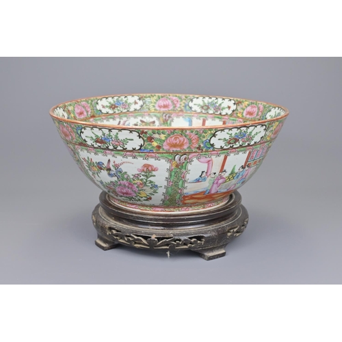 42 - A 19th century chinese cantonese punch bowl on wooden stand diameter approx. 33cm