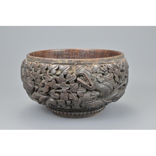 51 - Asian dragon carved wooden fruit bowl. diameter approx. 28cm (2)