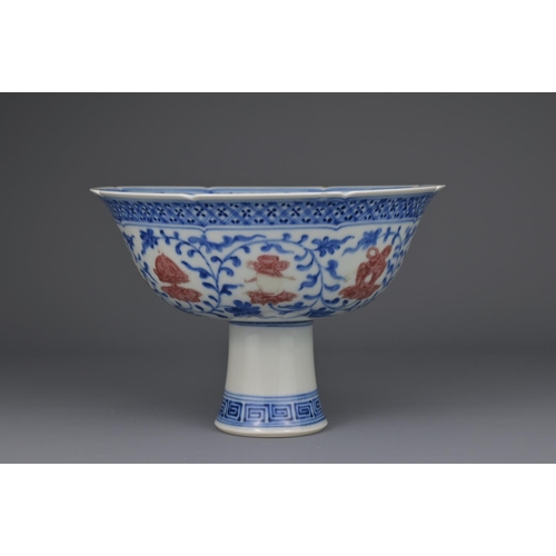 53 - Chinese underglaze blue and red ‘bajixiang’ porcelain lobed stem cup, qianlong mark decorated with t... 