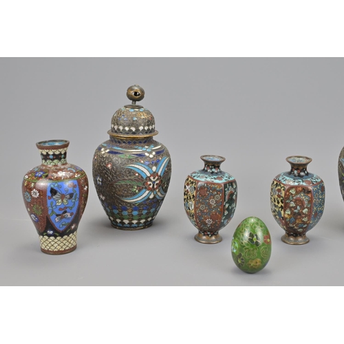 58 - Three pairs of japanese cloisonné items together with a cloisonné egg (7).