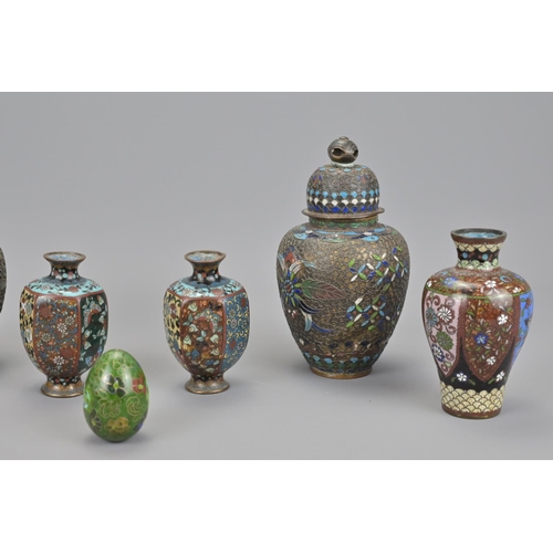 58 - Three pairs of japanese cloisonné items together with a cloisonné egg (7).