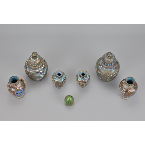 58 - Three pairs of japanese cloisonné items together with a cloisonné egg (7).