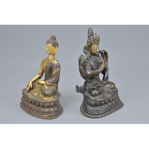 62 - Two asian bronze seated buddhas one with gilt detail. tallest height approx. 18cm (2)