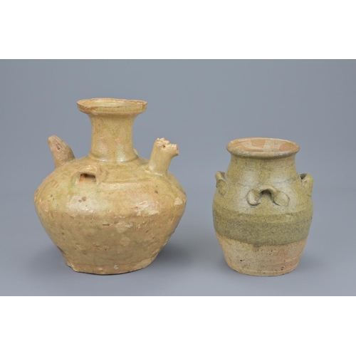 66 - A chinese jin dynasty pottery chicken head ewer and a song dynasty four-looped celadon jar. ewer hei... 