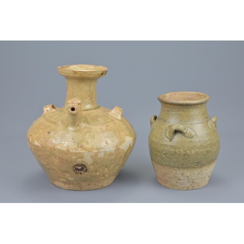 66 - A chinese jin dynasty pottery chicken head ewer and a song dynasty four-looped celadon jar. ewer hei... 