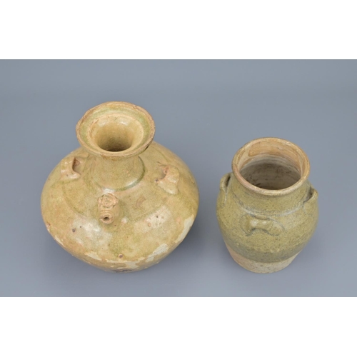 66 - A chinese jin dynasty pottery chicken head ewer and a song dynasty four-looped celadon jar. ewer hei... 