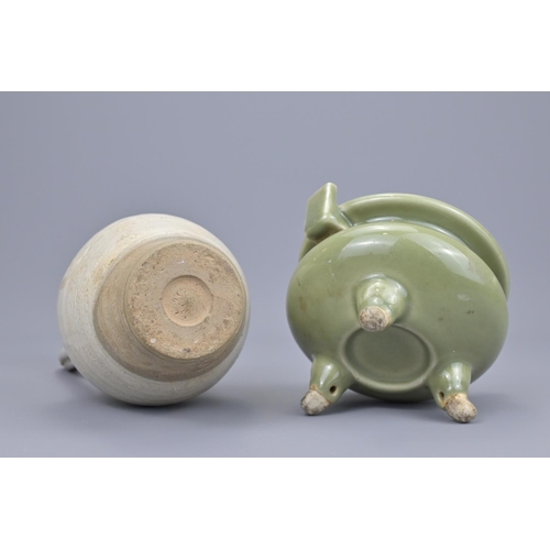 67 - A chinese white glazed chicken head ewer and a celadon tripod censer. ewer height approx. 25cm (2)