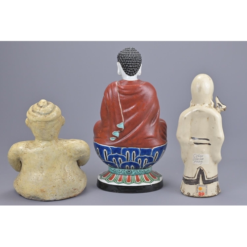 70 - A chinese cizhou ware shulou figure together with a thai seated figure and japanese kutani polychrom... 