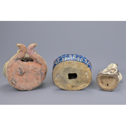 70 - A chinese cizhou ware shulou figure together with a thai seated figure and japanese kutani polychrom... 