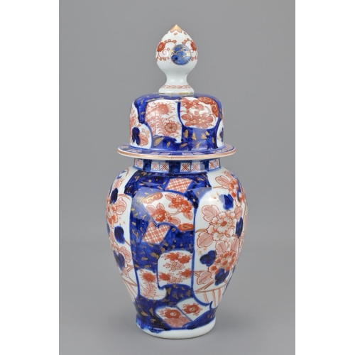 83 - A japanese imari jar and cover. height approx. 35cm