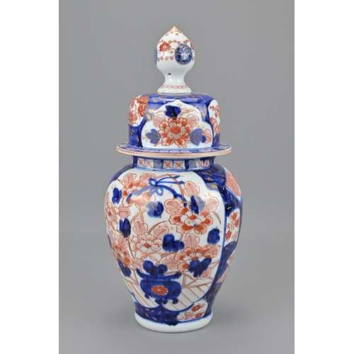 83 - A japanese imari jar and cover. height approx. 35cm