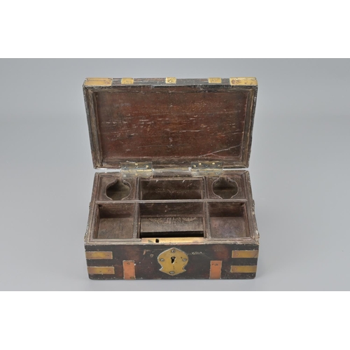 86 - An indian hardwood box with brass mounts and two handles. width approx. 25cm