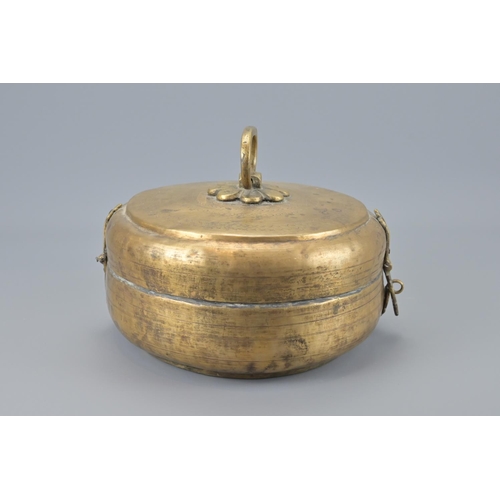 87 - An indian brass hinged box with lion padlock and key. width approx. 23cm