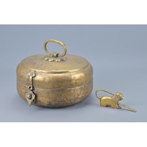 87 - An indian brass hinged box with lion padlock and key. width approx. 23cm