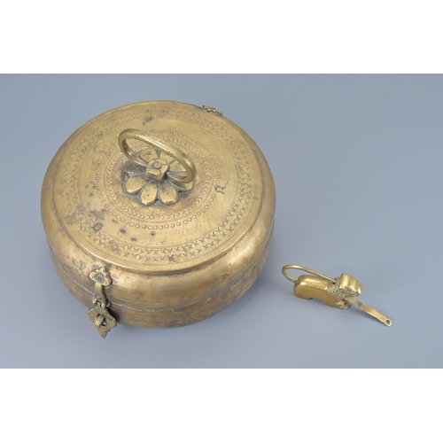 87 - An indian brass hinged box with lion padlock and key. width approx. 23cm