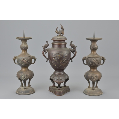 90 - A chinese bronze vase together with two japanese bronze candle stick holders. burners height approx.... 