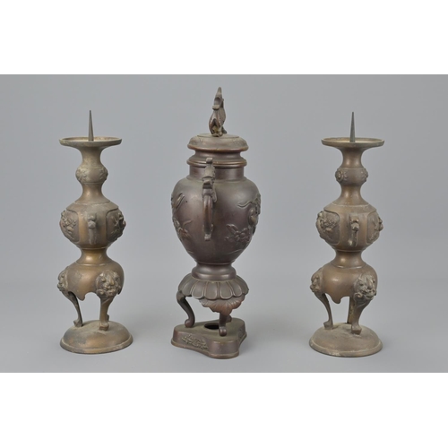 90 - A chinese bronze vase together with two japanese bronze candle stick holders. burners height approx.... 