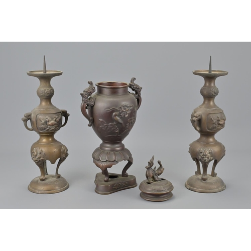 90 - A chinese bronze vase together with two japanese bronze candle stick holders. burners height approx.... 