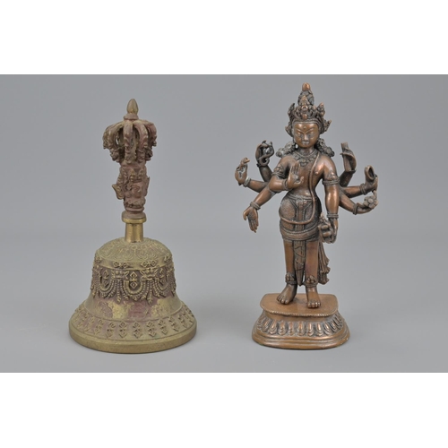 92 - An indian figure and tibetan bronze bell. figure height approx. 19cm (2)