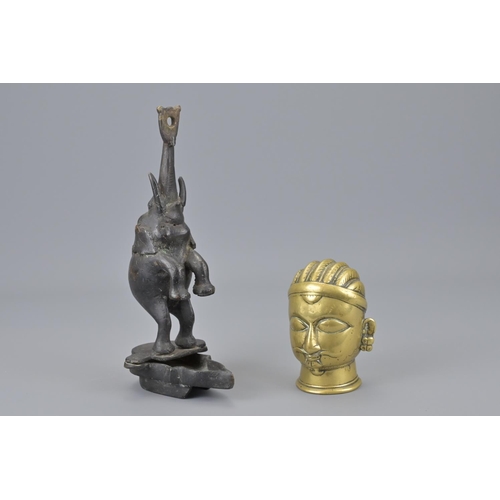 93 - An indian polished bronze head together with an indian bronze elephant. elephant height approx. 22cm... 