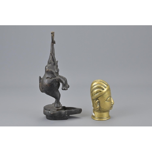 93 - An indian polished bronze head together with an indian bronze elephant. elephant height approx. 22cm... 