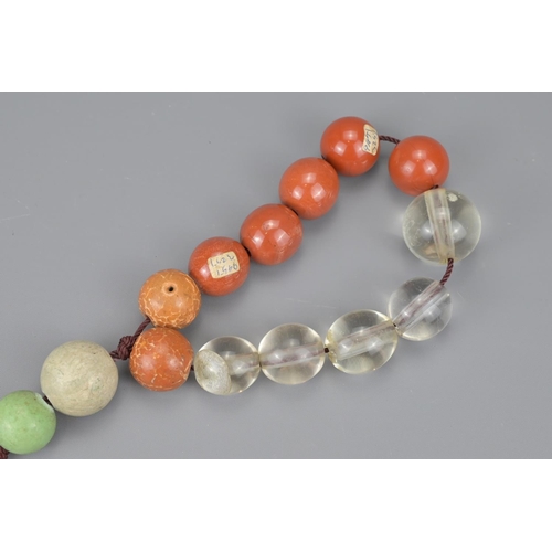 96 - Chinese praying beads including jade and crystal examples. larger bean 3cm diameter