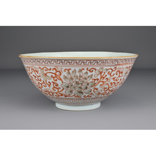 8 - A Chinese 19th Century iron-red porcelain bowl decorated with scrolling peonies. The base with Jiaqi... 