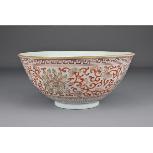 8 - A Chinese 19th Century iron-red porcelain bowl decorated with scrolling peonies. The base with Jiaqi... 