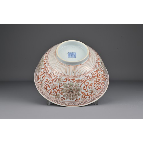 8 - A Chinese 19th Century iron-red porcelain bowl decorated with scrolling peonies. The base with Jiaqi... 