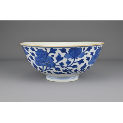 7 - A Chinese early 19th Century blue and white porcelain bowl. The exterior decorated with scrolling pe... 